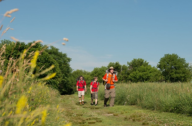 man hiking with boyscouts