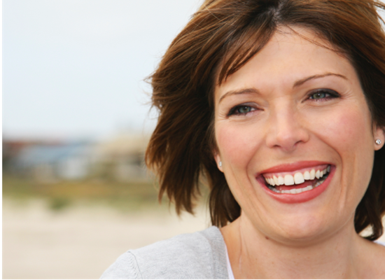 woman showing her teeth smiling